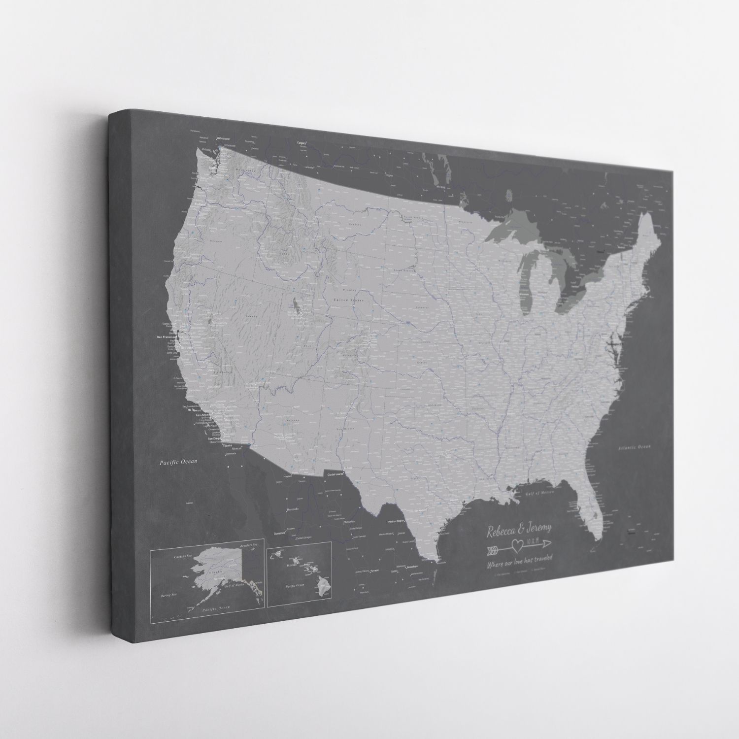 Angled view of gallery wrapped Stormy Dreams USA canvas travel map in charcoal grey tones with personalized couples text