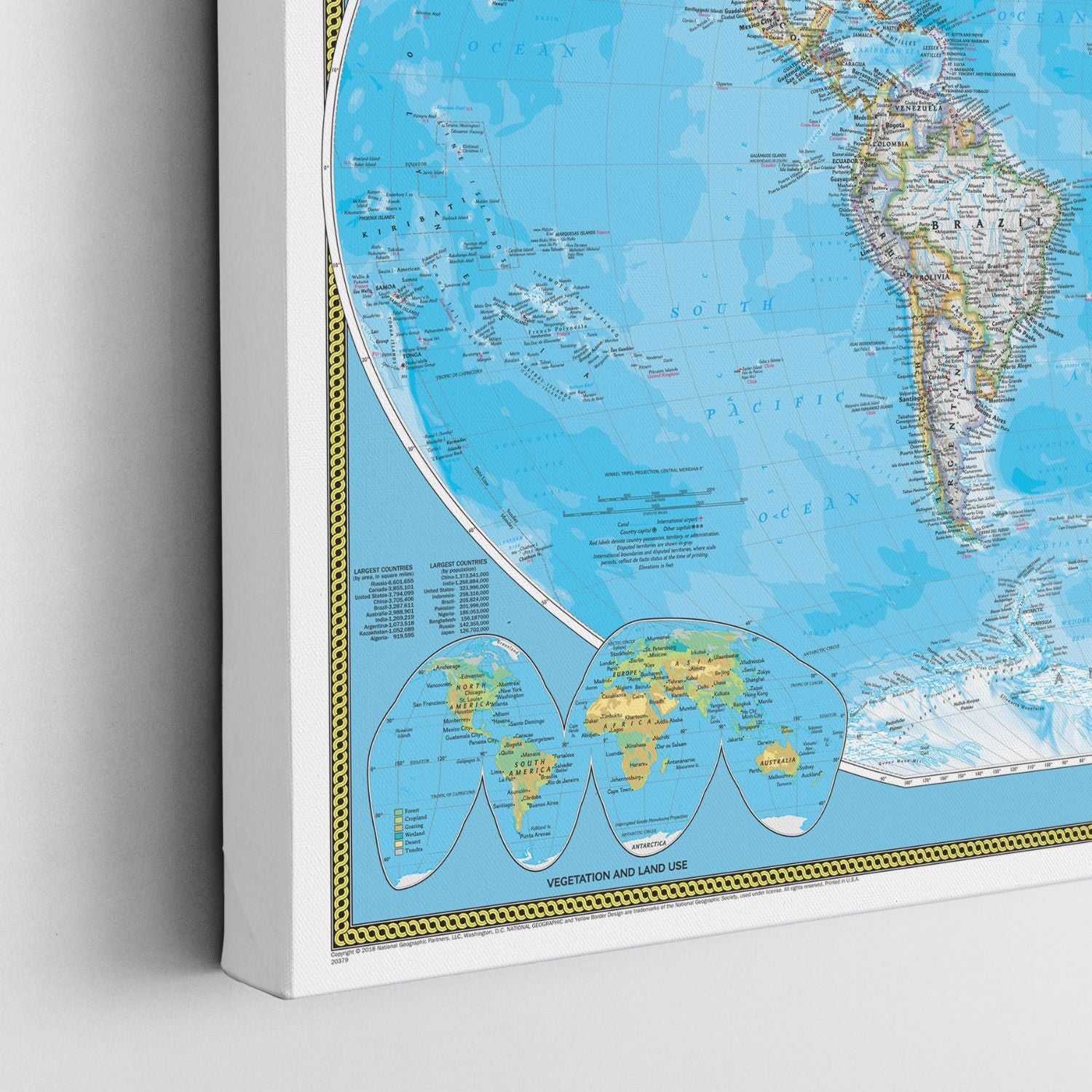 Angled corner view of gallery wrapped classic world travel map canvas showing South Pacific Ocean and South America detail