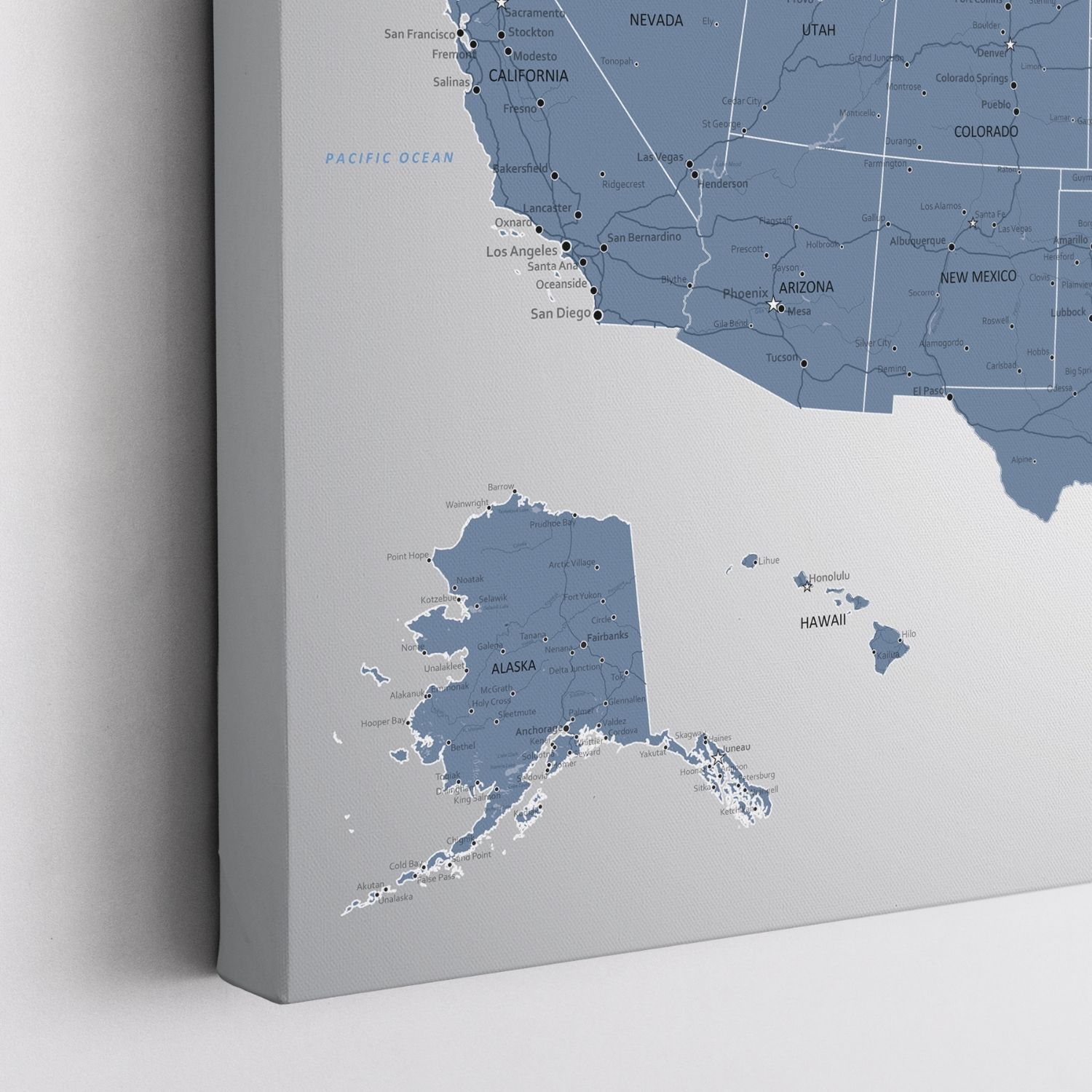Close-up corner view of Blue Ice USA travel map canvas gallery wrap showing Alaska Hawaii California states with city pins
