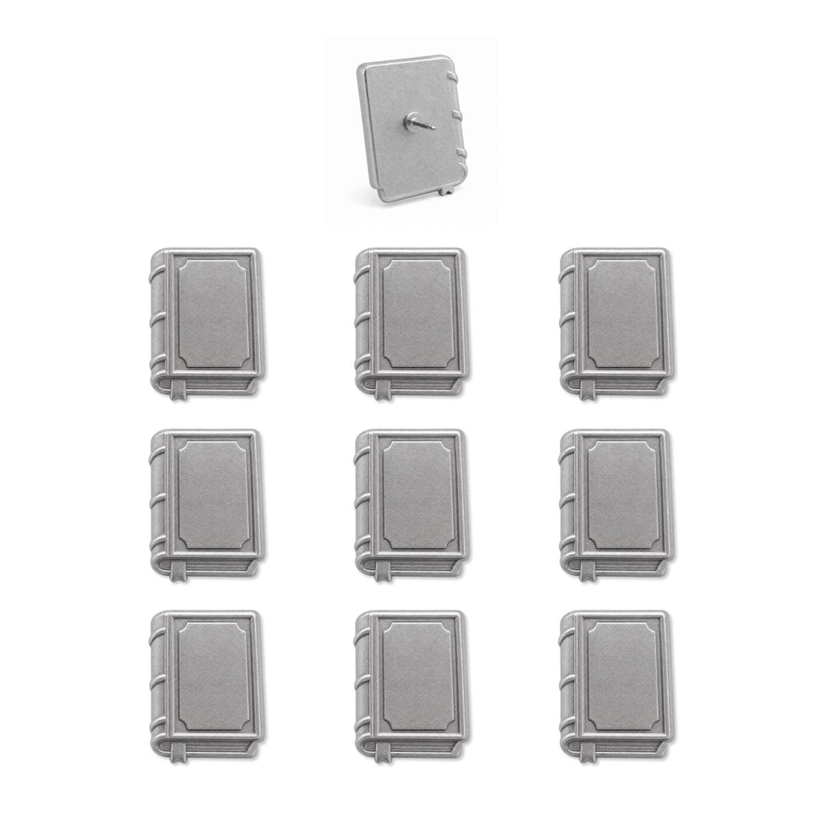 Set of nine silver book-shaped push pins with one showing pin backing on white background