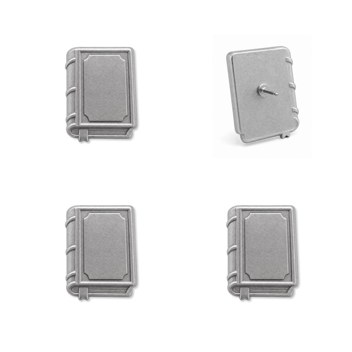 Four silver metal book push pins showing front and back views with embossed covers and pin backing