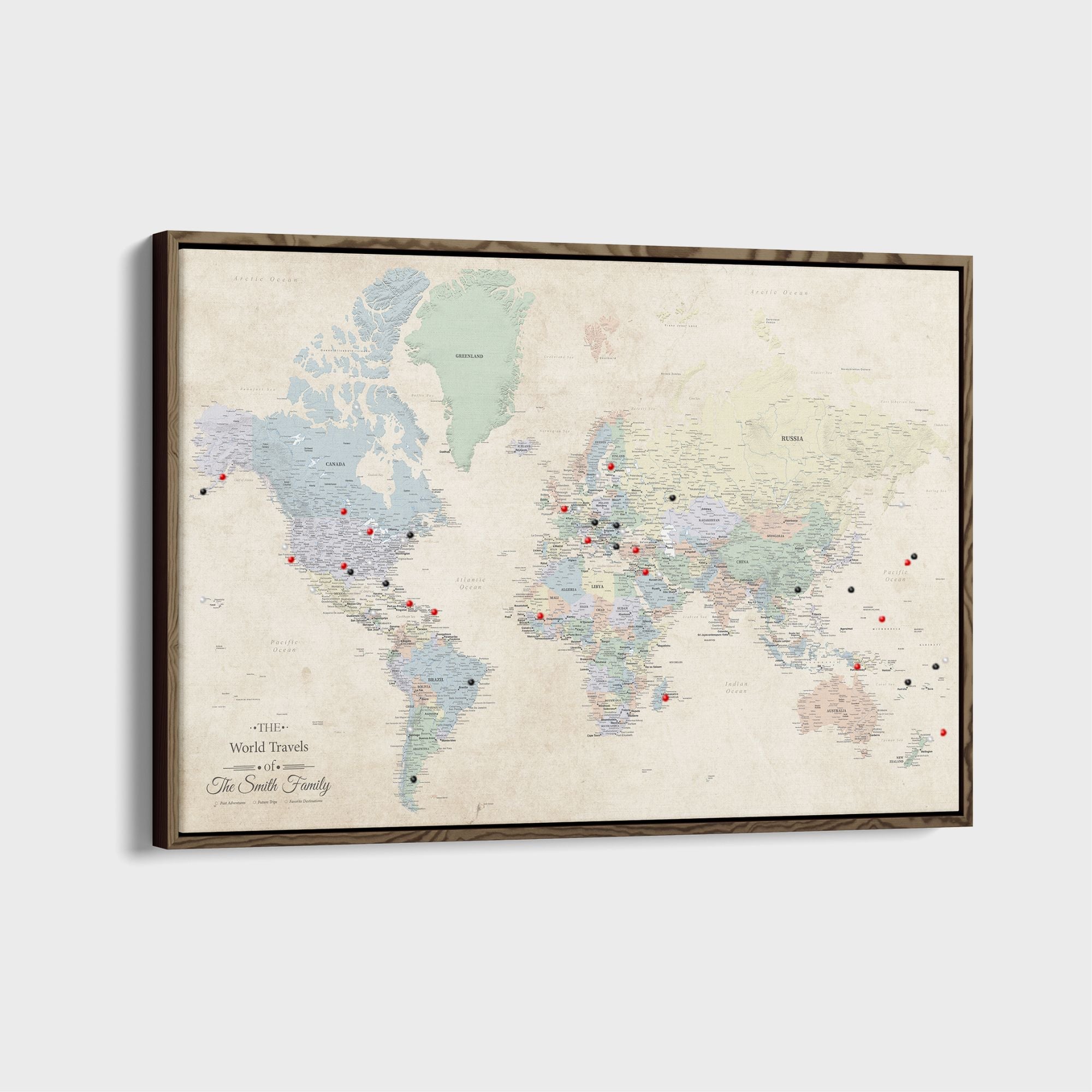 Sandy Dreams personalized canvas world travel map with red and black push pins in walnut frame