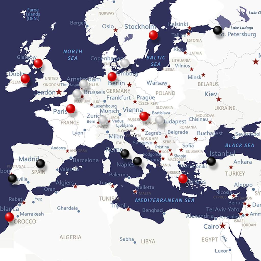 Navy Explorers canvas world travel map close-up of Europe with red white and black push pins marking visited cities
