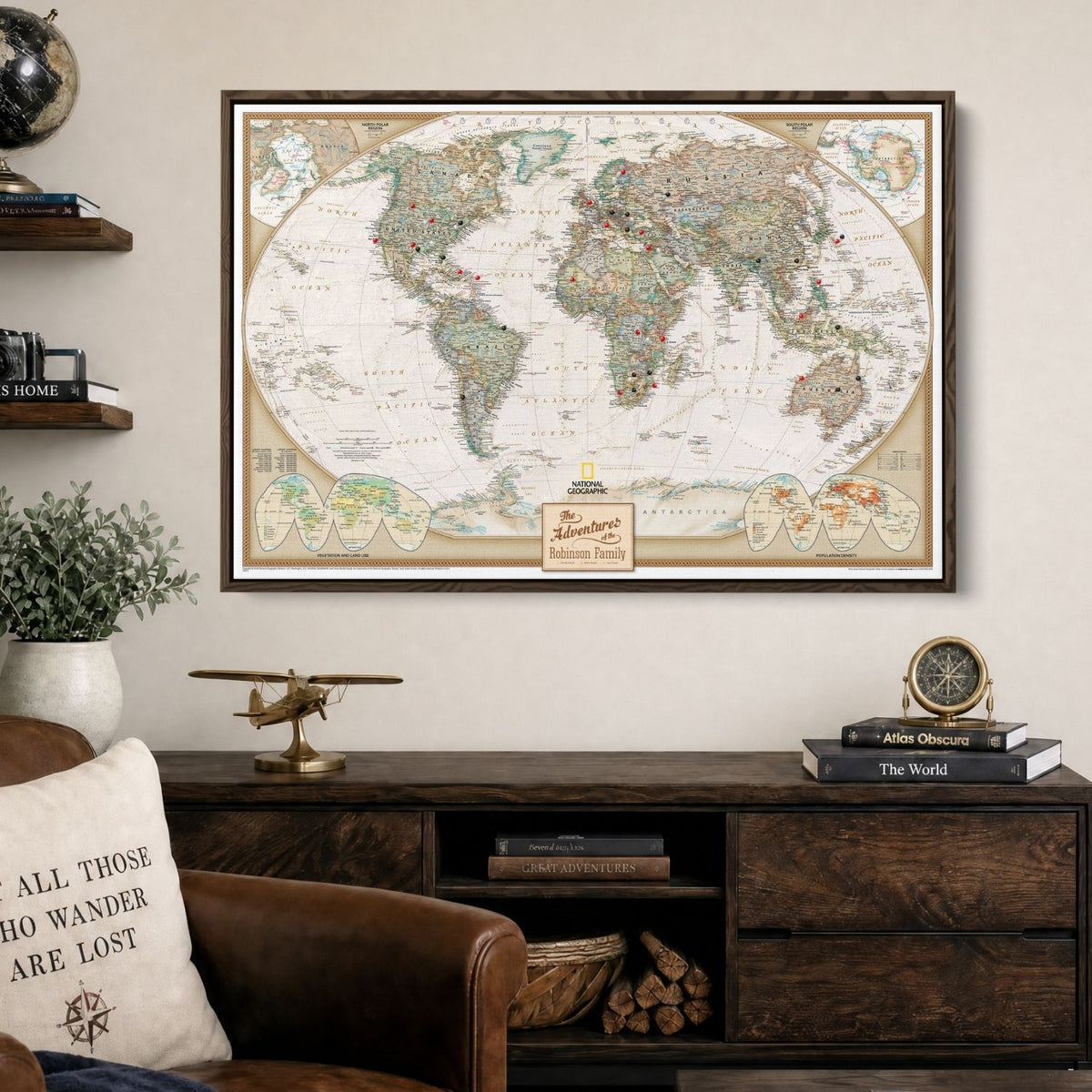 Executive World push pin travel map in a brown float frame above a leather chair
