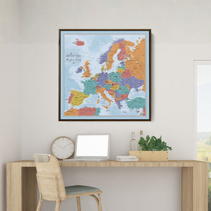 Personalized framed canvas Blue Oceans Europe travel map with push pins displayed above modern wooden desk