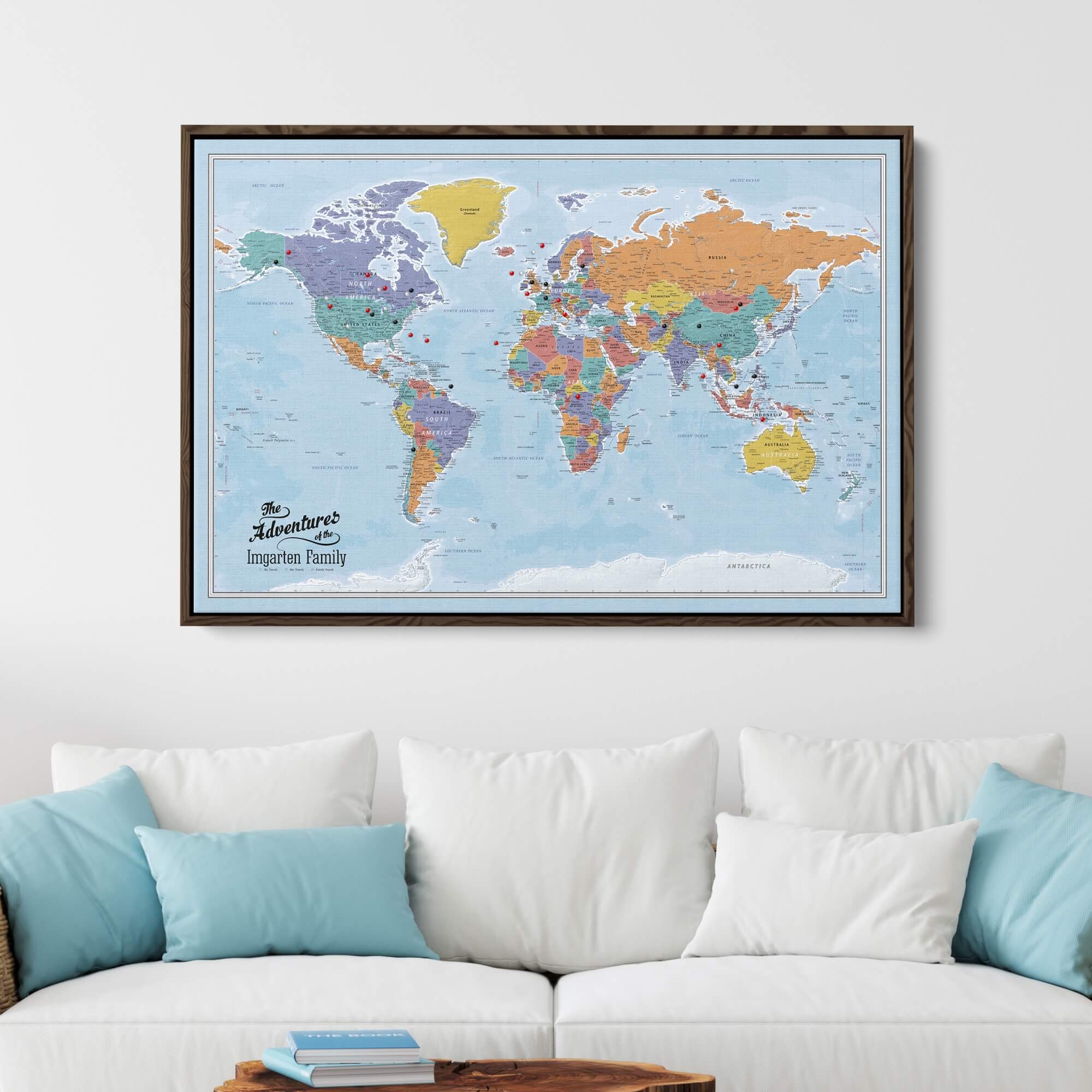 Blue Oceans world travel map canvas with pins in a wood float frame