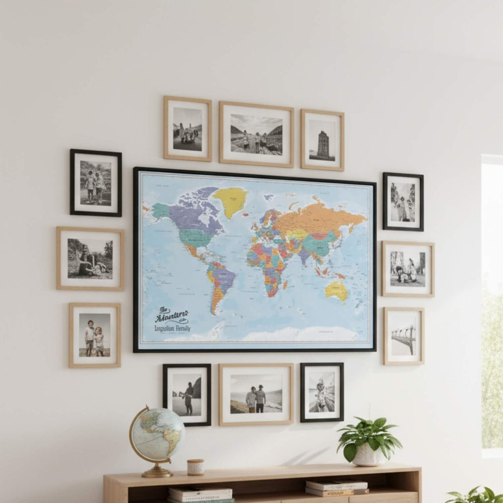 Framed Blue Oceans World Travel Map with pins displayed in gallery wall with family travel photos