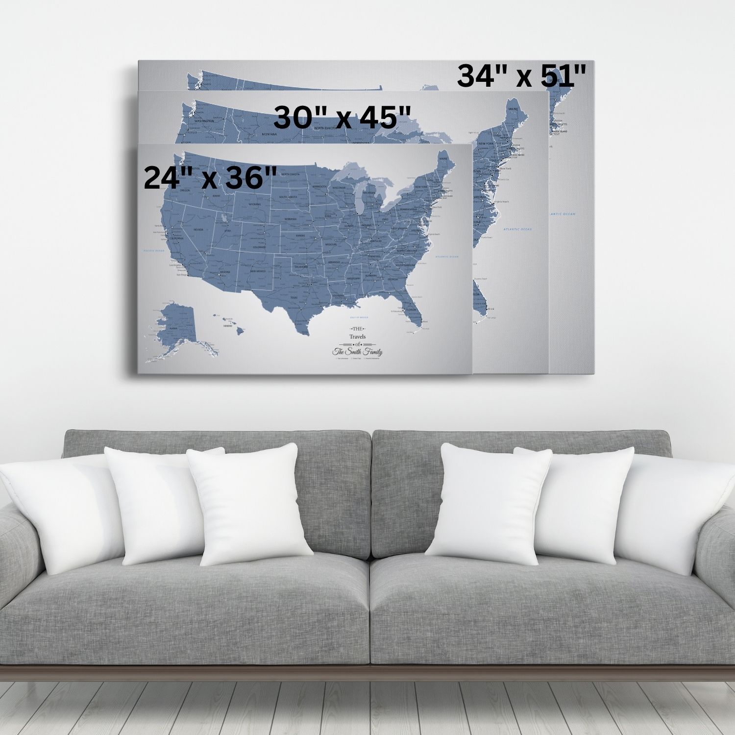 Navy blue ice USA travel map canvas wall art displayed above gray sofa showing three size options 24x36 30x45 34x51