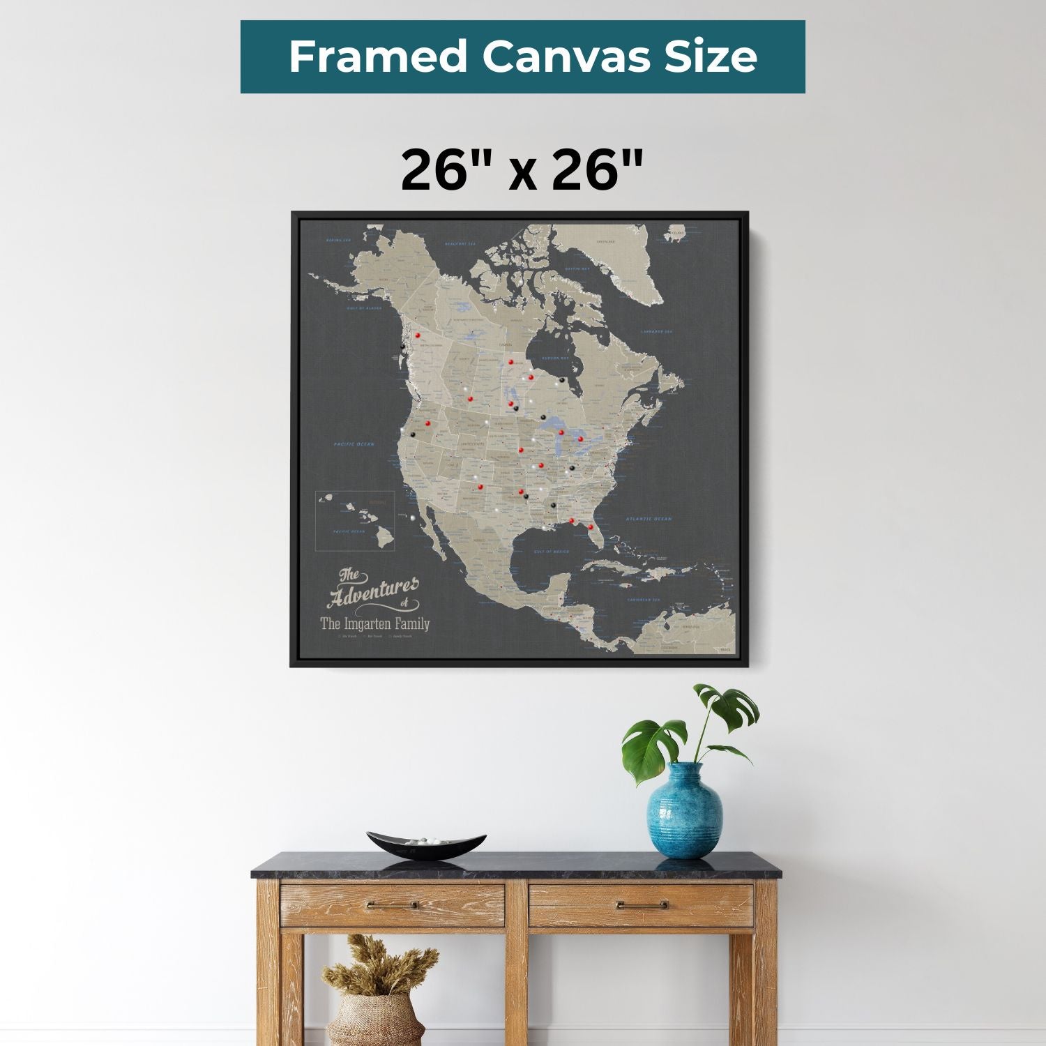Black framed 26x26 earth toned North America travel map canvas with push pins displayed above console table