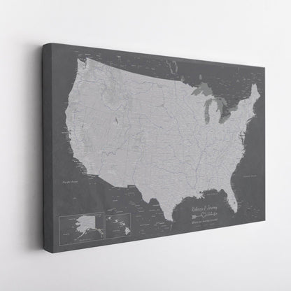 Angled view of gallery wrapped Stormy Dreams USA canvas travel map in charcoal grey tones with personalized couples text