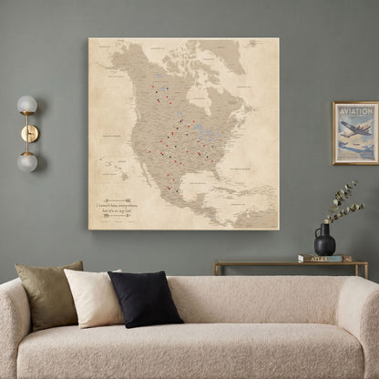 Vintage North America push pin travel map canvas hung above modern living room sofa