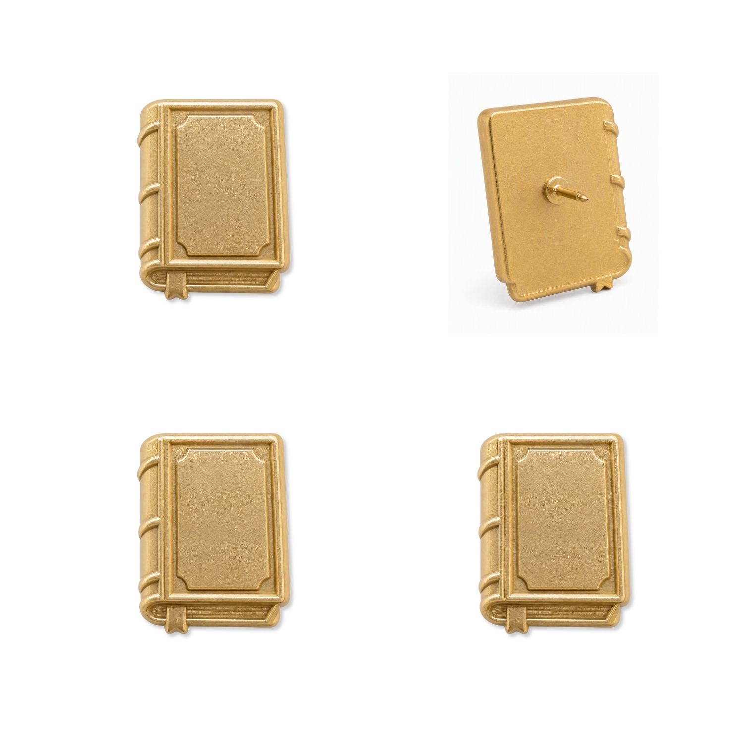 Four matte gold book-shaped push pins showing front and back views with pin backing detail