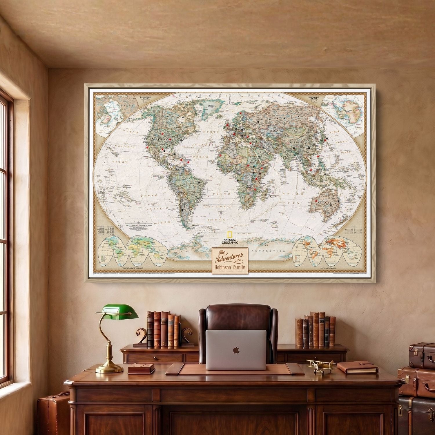 Framed canvas executive world travel map in Natural frame with red and black pins hung above desk