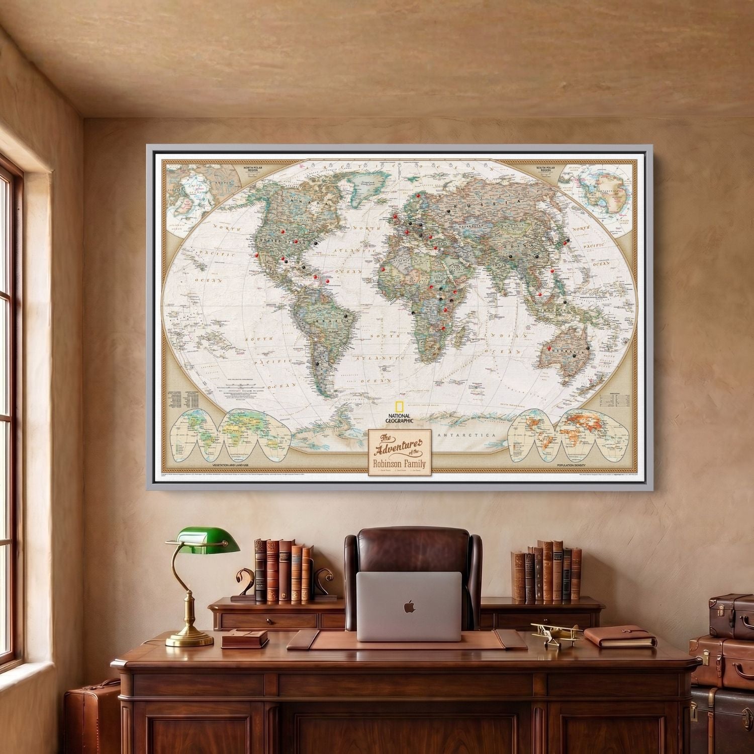 Framed canvas executive world travel map in Silver frame with red and black pins hung above desk
