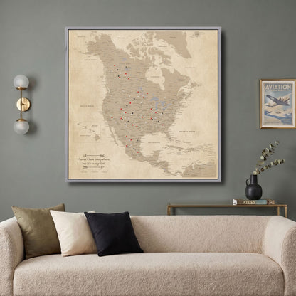 Vintage North America push pin travel map canvas hung above modern living room sofa