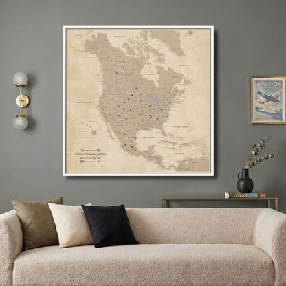 Vintage North America push pin travel map canvas hung above modern living room sofa